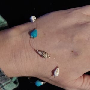 Avon Shell Bead Bracelet with Clear Plastic String Vintage